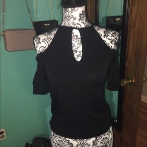 Black flowy cold shoulder top. Gently used